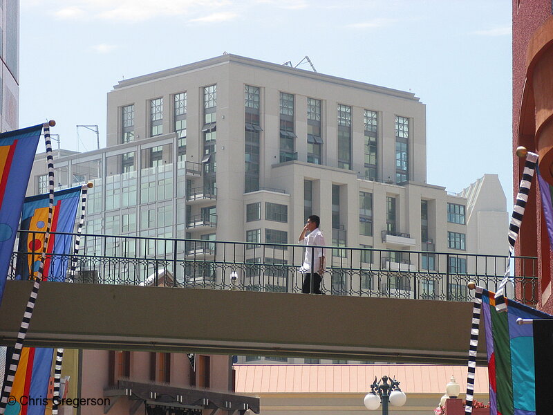Photo of Man Crossing Pedestrian Bridge Downtown(4331)