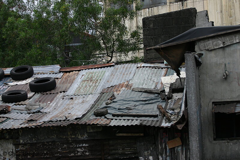 Photo of Shanty Roof made from Sheet Metal and Car Tires(4426)