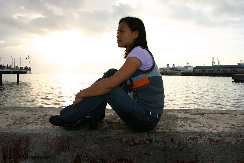 Photo of Woman Sitting on Cement Wall(4435)