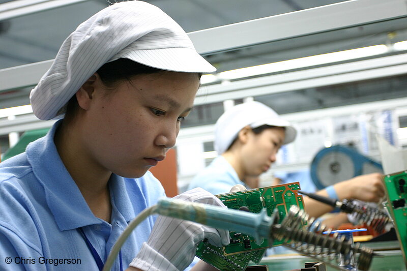 Photo of Electronics Worker at Soldering Station(4880)