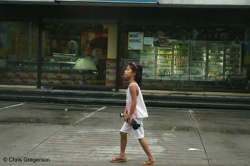 Photo of Young Girl Walking Past Shops, Angeles City(5021)