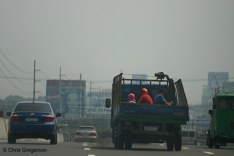 Photo of Truck with Workers on the Freeway into Manila(5026)