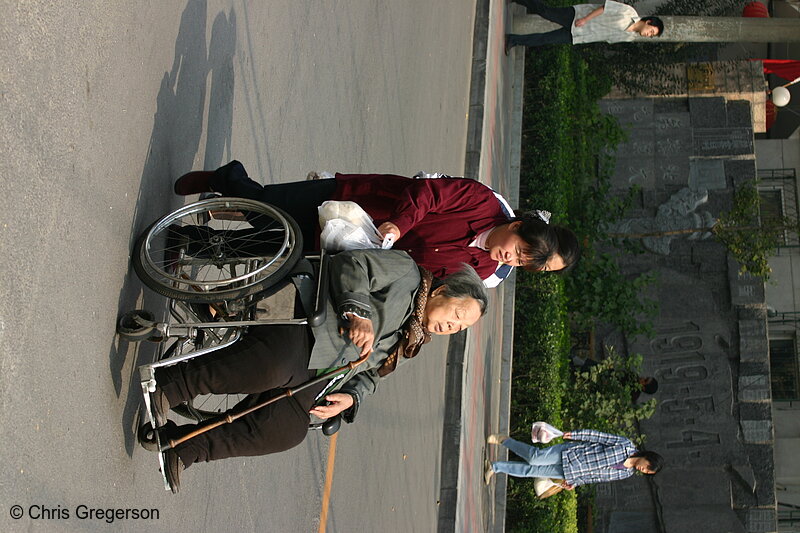 Photo of Older Chinese Woman in Wheelchair, Road in Beijing(5148)