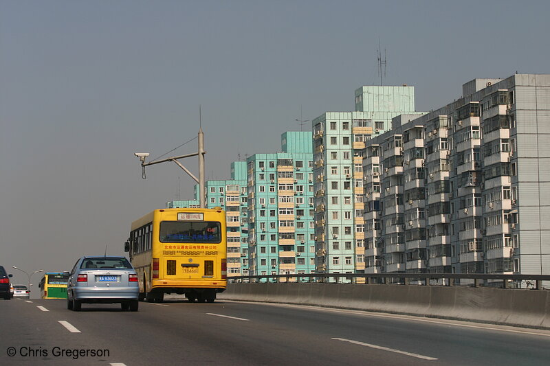 Photo of Beijing Freeway with Yellow Bus and High-Rises(5153)