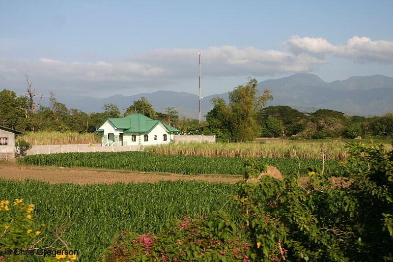 Photo of A House Surrounded by Vegetation and Mountains(5544)
