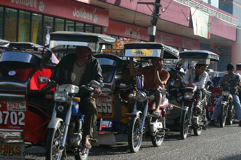 Photo of A Queue of Tricycles Near Jollibee Fast Food Restaurant in Tarlac(5707)