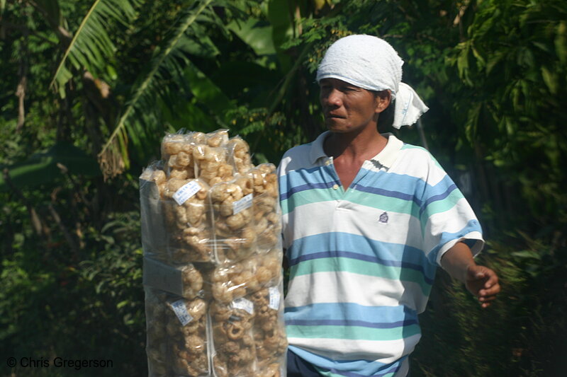 Photo of A Filipino Vendor Selling Chicharon (Fried Pork Skin) Crackers (5714)