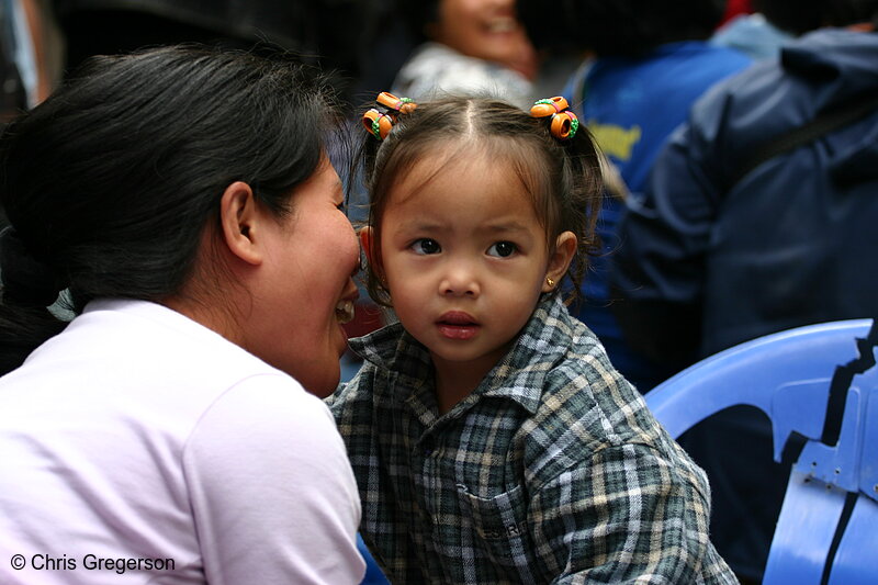 Photo of A Mother Whispering to Her Daughter in Baguio City, Philippines(5776)