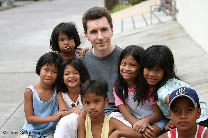 Photo of American with Neighborhood Children in Angeles City, Philippines(6593)