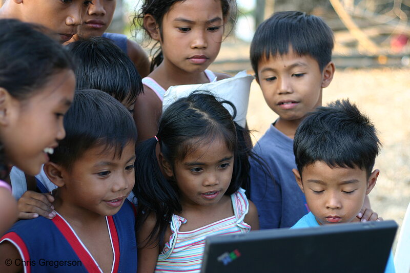 Photo of Children Gathered Around a Laptop Computer in the Rural Philippines(6706)