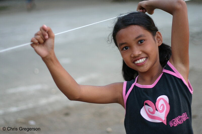 Photo of Girl Holding Clothes-Line, Rural Philippines(6712)