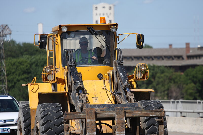 Photo of Construction Worker Driving Front-End Loader(7413)