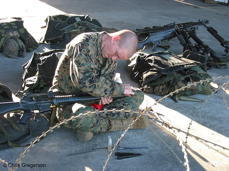 Photo of Marine Cleaning his Rifle(7515)