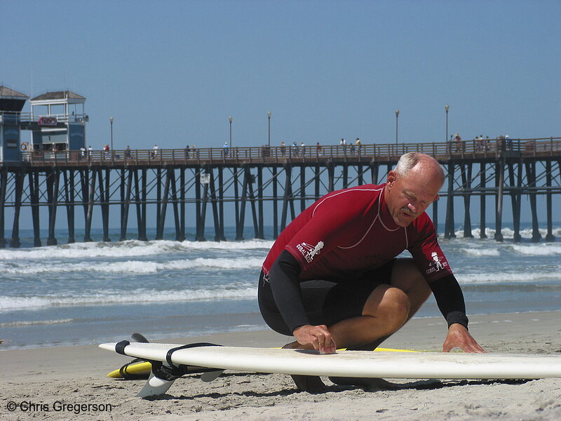 Photo of Man Waxing Surfboard, Oceanside, California(4285)