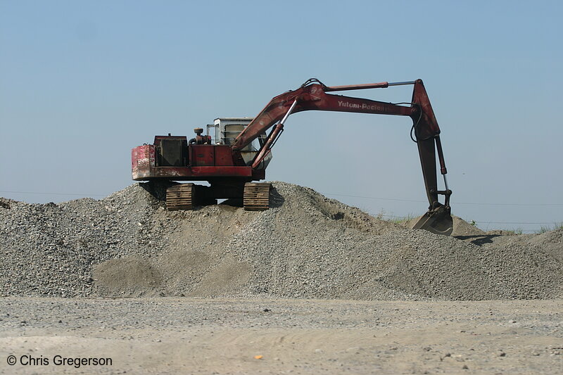Photo of Backhoe on Gravel Pile, the Philippines(4352)