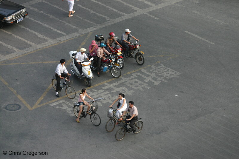 Photo of Scooters, Motorcycles, and Bicycles at an Intersection in China(5105)