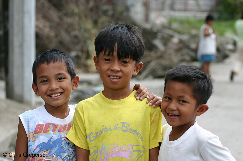 Photo of Three Filipino Young Boys Smiling Standing on the Street(5272)