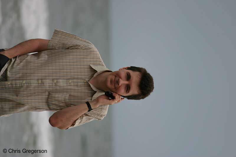 Photo of Young Man on Cellphone at the Beach(5401)