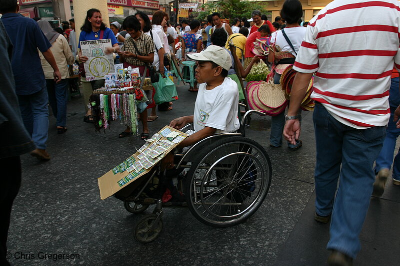 Photo of Disabled Man in a Wheelchair selling Sweepstakes Tickets near Quiapo Church(5501)