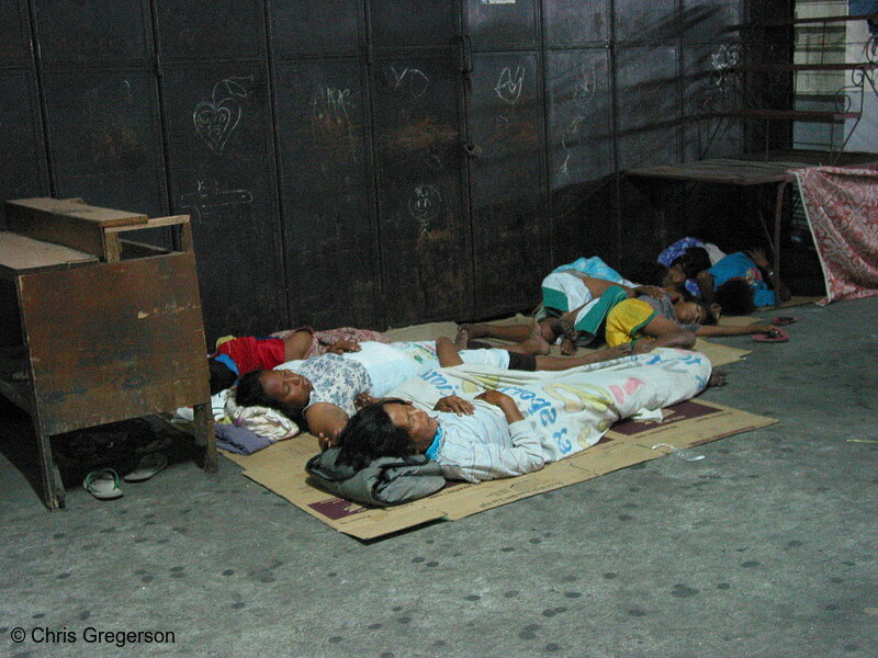Photo of A Group of People Sleeps at the Bus Station in Angeles City(5570)