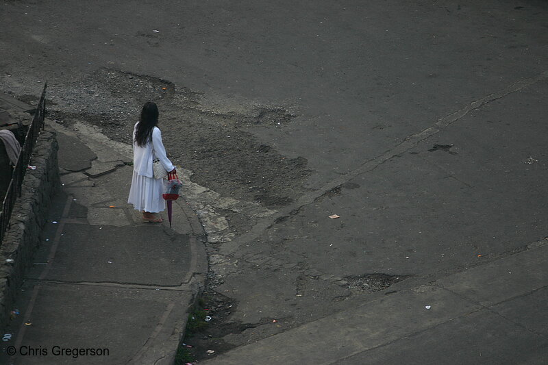 Photo of A Lady in White at the Corner of a Street in Baguio City, Philippines(5742)