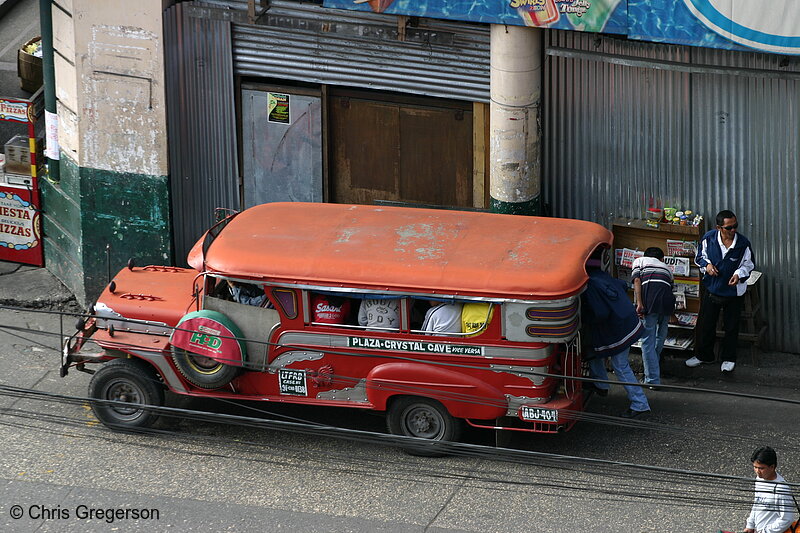 Photo of A Red Jeepney Loading a Passenger in Mabini Street, Baguio City, Philippines(5745)
