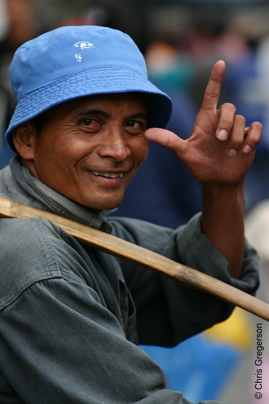 Photo of A Smiling Old Man Uses a Bamboo Rod in Carrying His Goods in Baguio Public Market(5766)