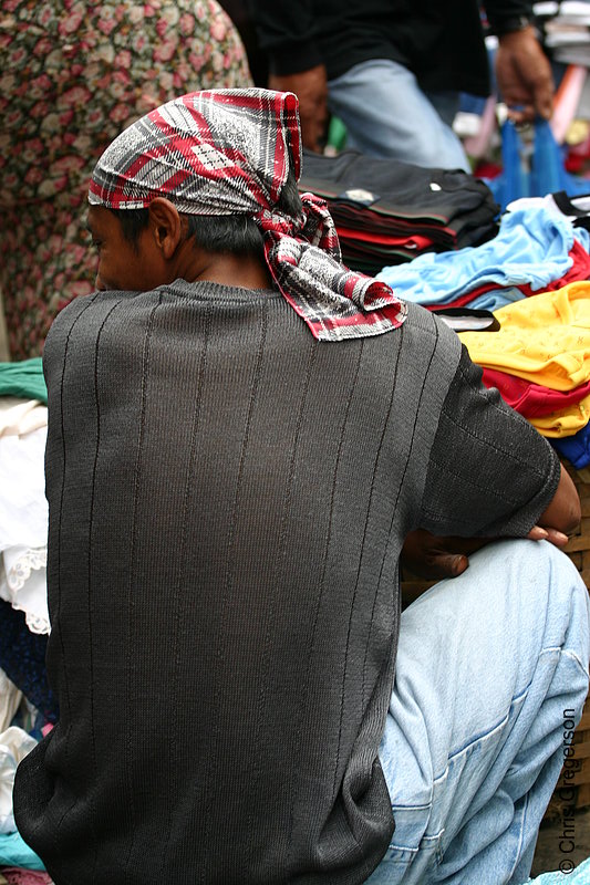 Photo of Back of a Man Squatting and Wearing a Headscarf in the Baguio Public Market(5771)