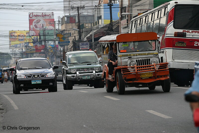 Photo of Cars, Jeepney, and bus on MacArthur highway, Pampanga, Philippines(5838)