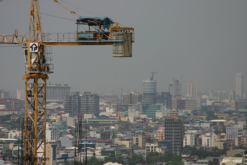 Photo of Construction Crane and Manila Rooftops(6421)