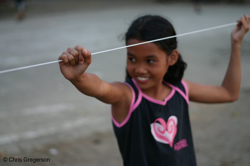 Photo of Girl Holding Clothes-Line, Rural Philippines(6711)