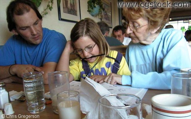 Marc, Kaitlin, and Linda at a Restaurant