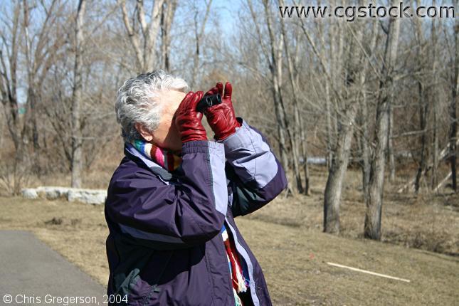 Woman Birdwatching with Binoculars