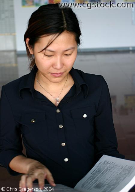 Woman Reading a Textbook
