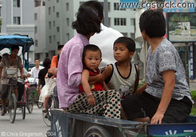 Family Riding in a Bike Wagon, China