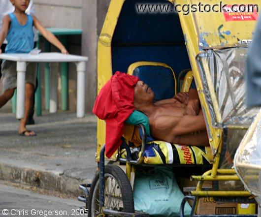 Filipino Man Sleeping in a Sidecar