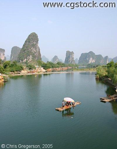Karst Mountains and Couple on River Raft