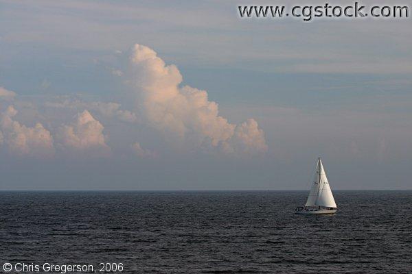 Sailboat and Cloudscape on the Atlantic Ocean