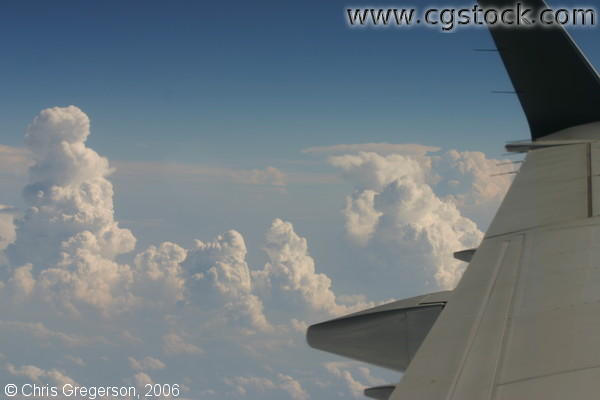 Clouds, Sky, and Wing During Airline Flight