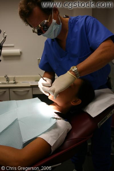 Dentist Checking a Woman's Teeth