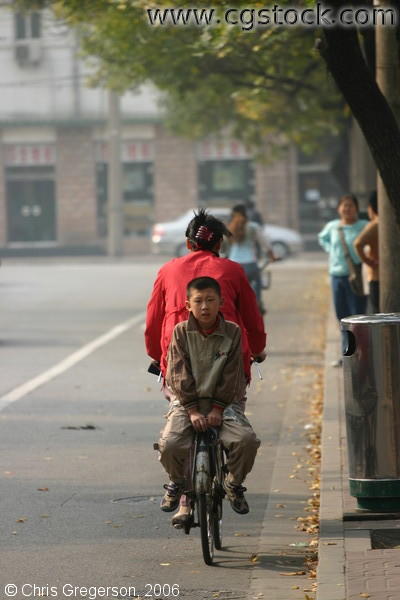 Young Boy Riding on the Back of a Bicycle, Beijing
