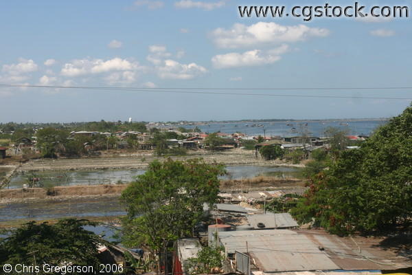 Shabby Houses Near a Fish Pond in Cavite