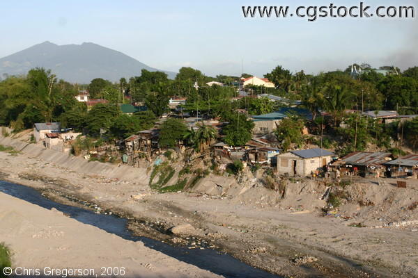 Shanties on the Abacan River with Mount Arayat in the Background