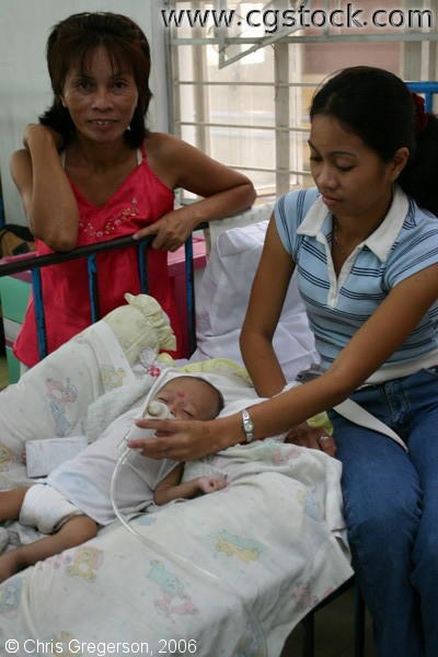 Mother Assisting Baby with Inhaler in Ospital ng Angeles' (ONA) Nursery 