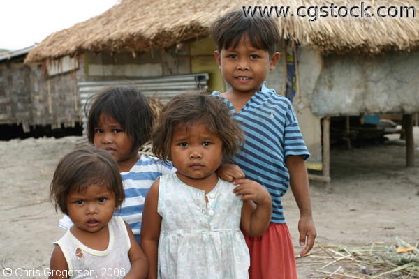 Toddler/Pre-School Aeta Kids Standing in front of a House