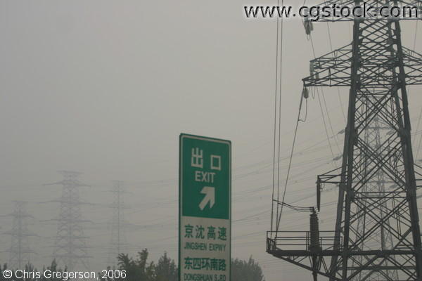 Power lines and Road Sign to Beijing Airport