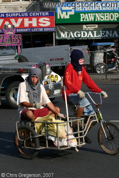 Partners Traveling on Pedicab along Bacoor, Cavite