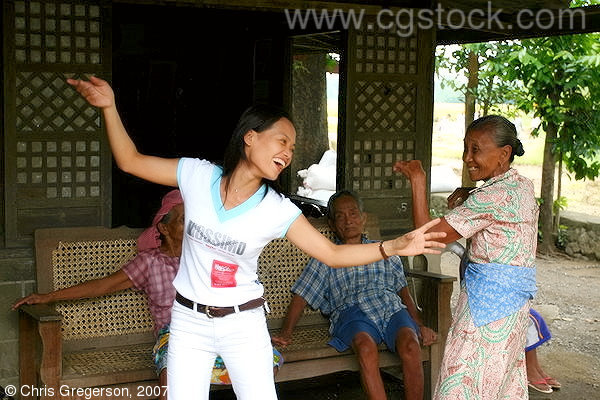 Young Filipina Dancing Ilocano Folk Dance (Karinosa) with her Aunt