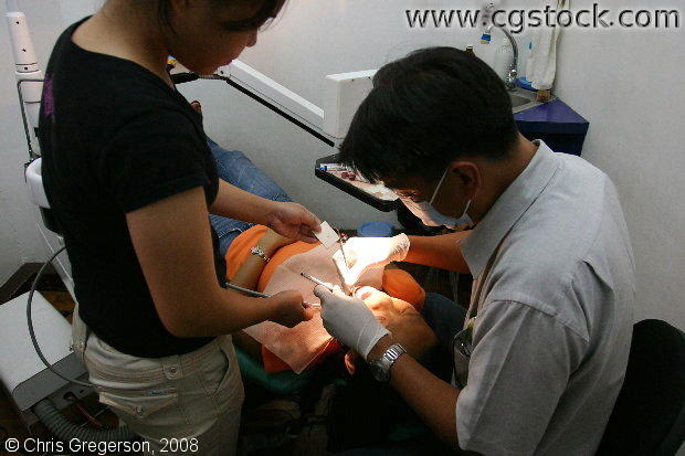 Dentist Working on a Patient, Manila, the Philippines
