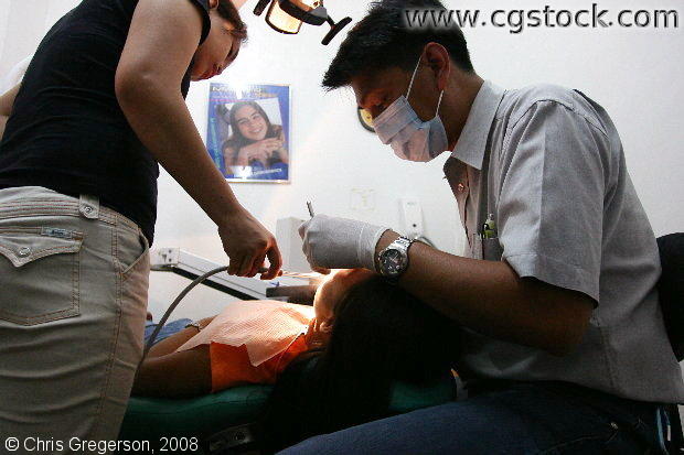Dentist Working on a Patient, Manila, the Philippines